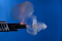 A real 45cal. bullet leaving the muzzle